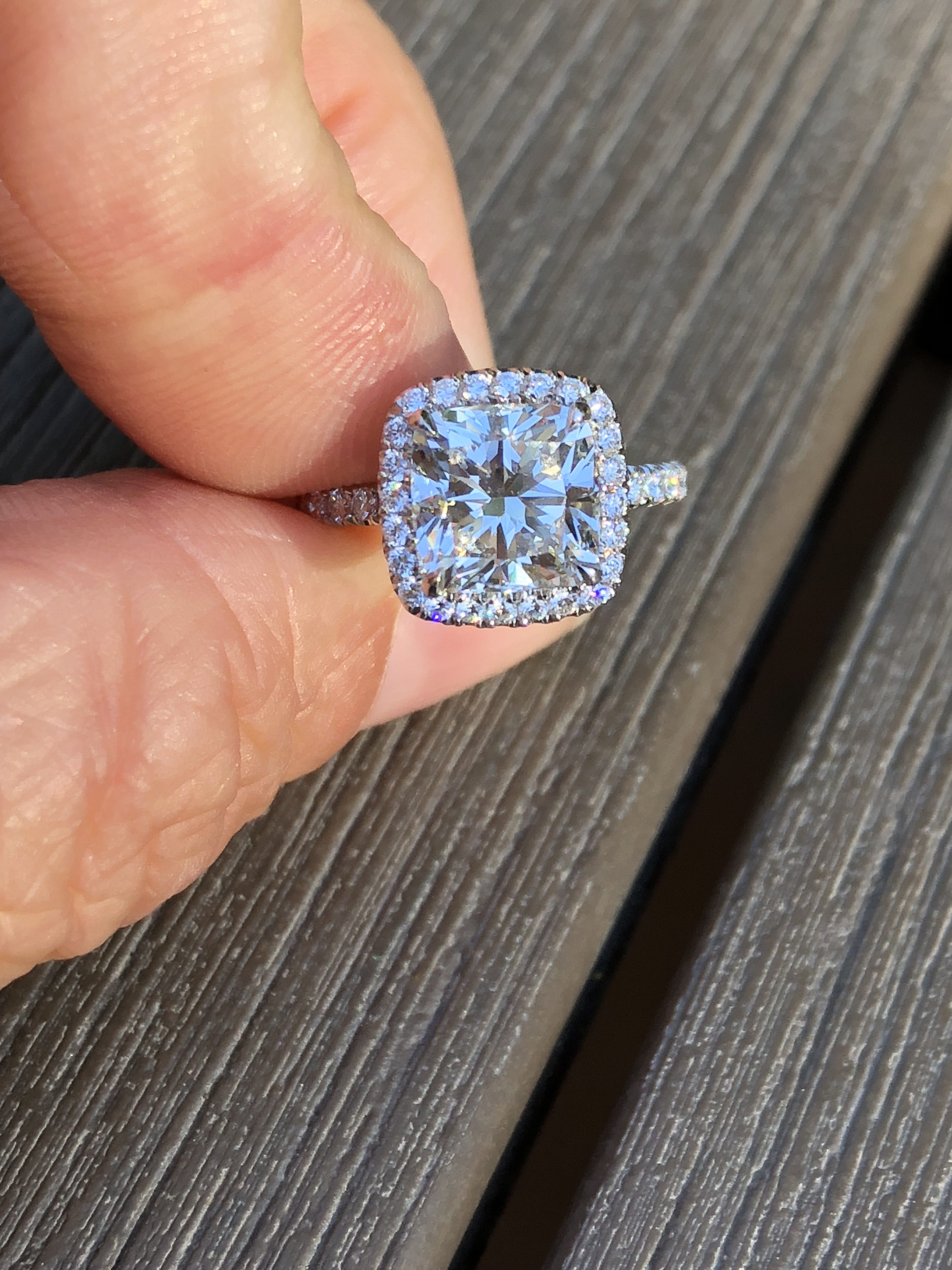Cushion diamond engagement ring with halo