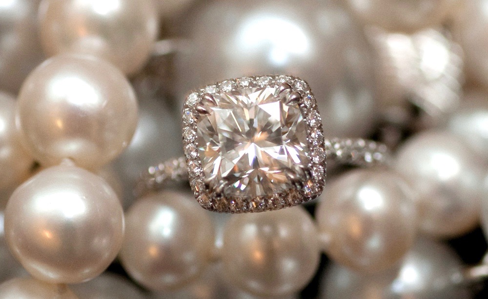 Cushion diamond engagement ring with diamond halo