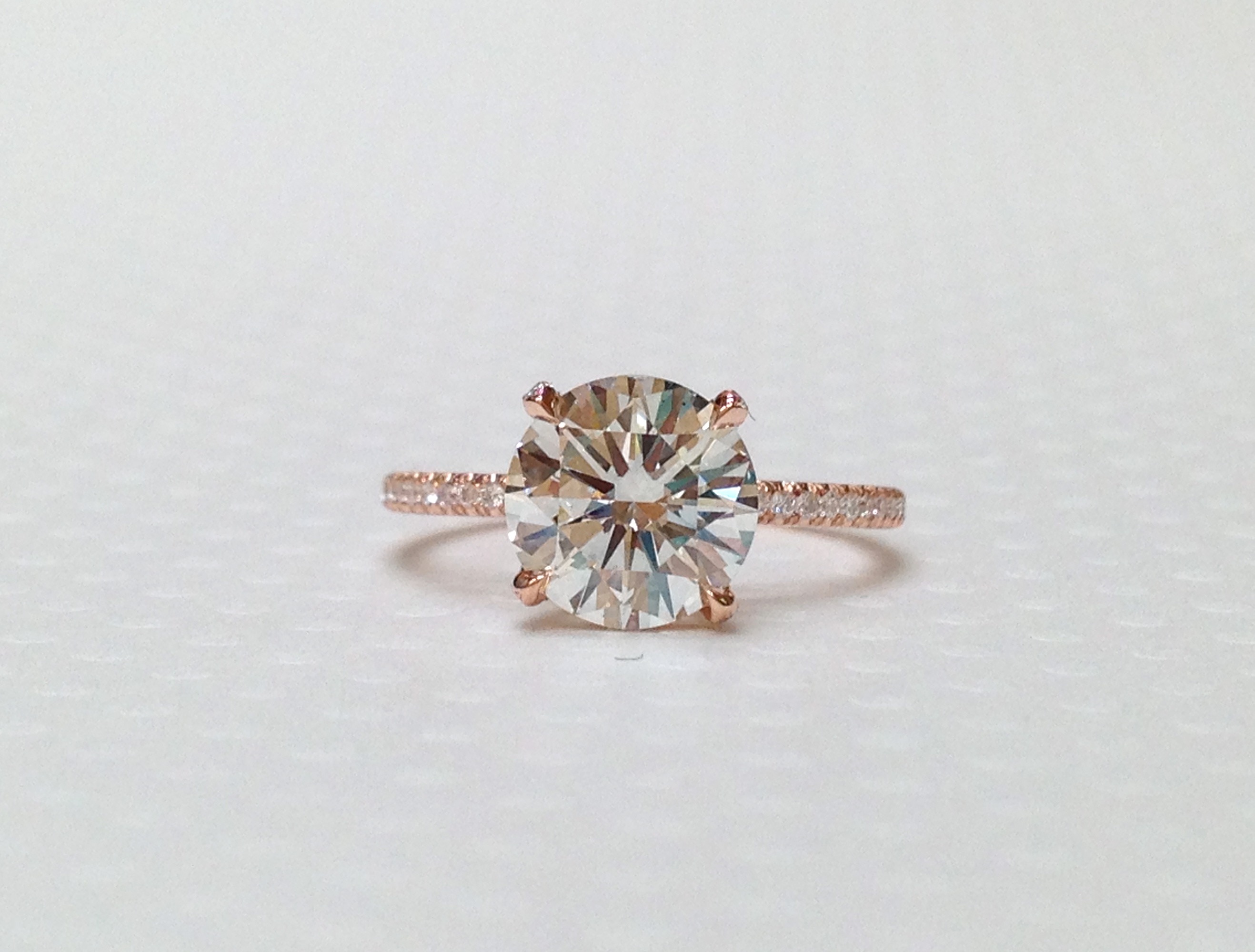 Round diamond solitaire set in rose gold mounting