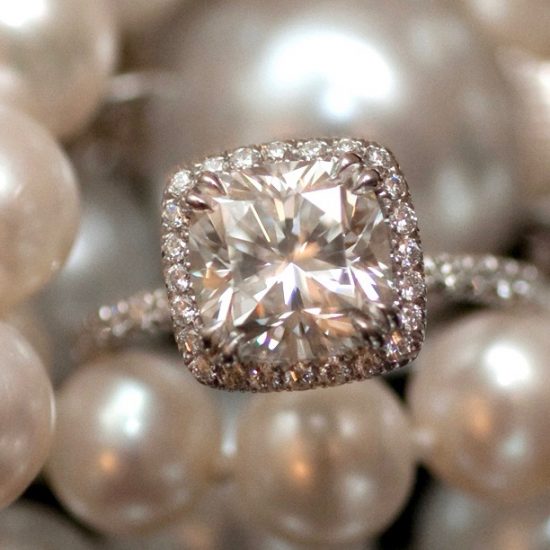 Cushion diamond engagement ring with diamond halo